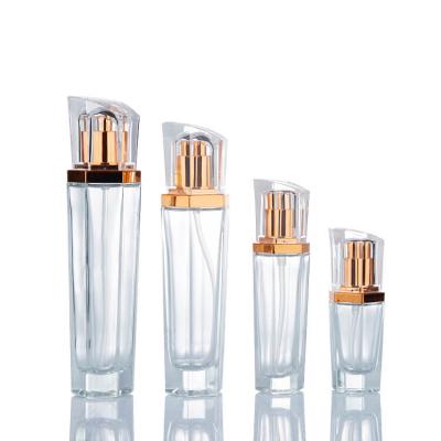 Establecer botellas de bomba de loción de vidrio cosmético transparente