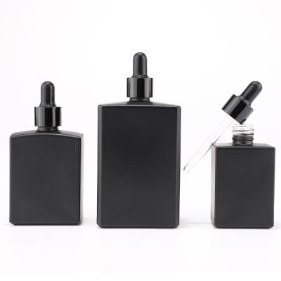frasco de vidrio rectangular negro mate con cuentagotas negro
