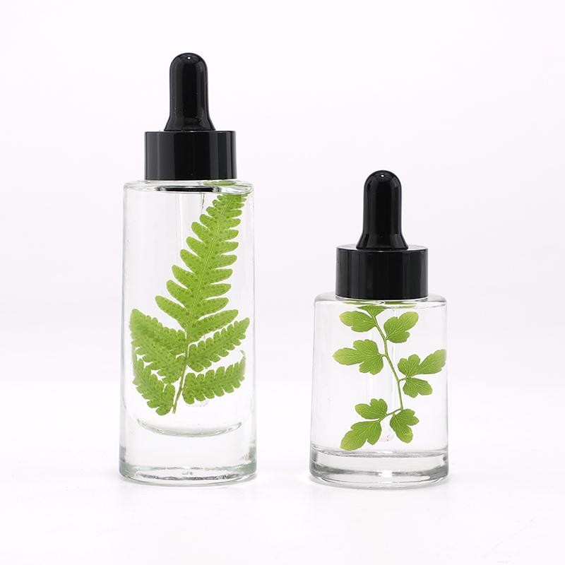 Clear transparent glass essential oil bottle
