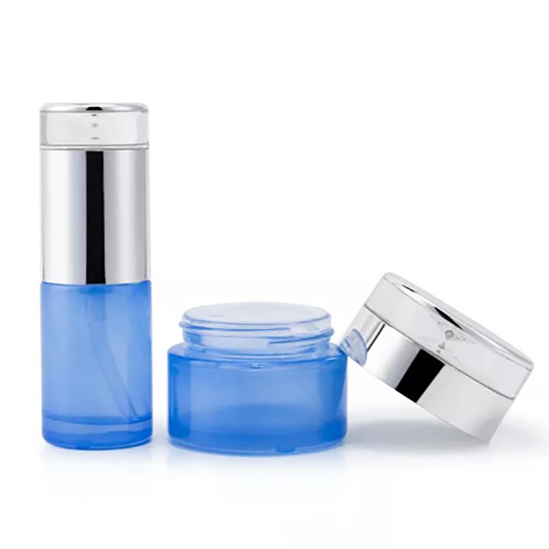 Empty matte blue cosmetic glass bottle