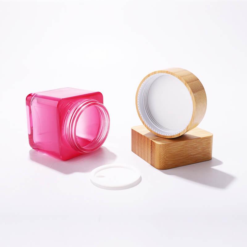 Tarro de cristal cosmético de 100g con cubierta de bambú de color personalizado

