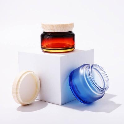 Frasco de vidrio redondo de nuevo diseño con tapa de rosca de transferencia de agua para envases cosméticos