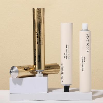 Envase vacío de tubo de crema de manos dorado