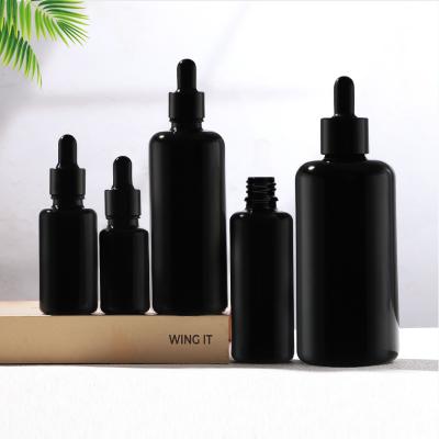 Juego de botellas cosméticas de vidrio con gotero negro