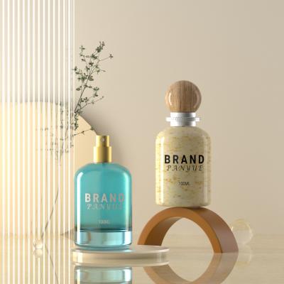 Botella de perfume cilíndrica de hombro redondo de 100 ml