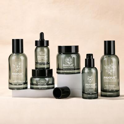 Juego de botellas cosméticas de vidrio gris ahumado