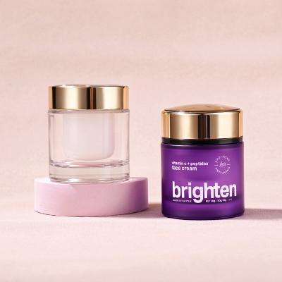 Tarro de crema cosmética morado rellenable