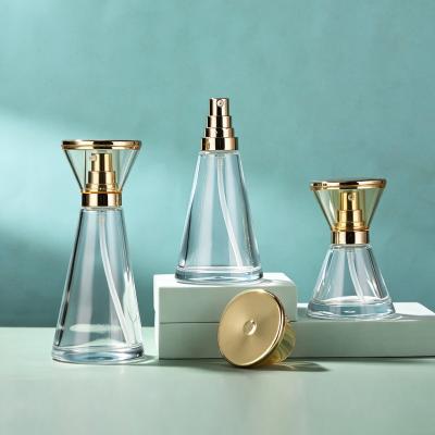Set de cosméticos de vidrio en forma de reloj de arena con tapa dorada