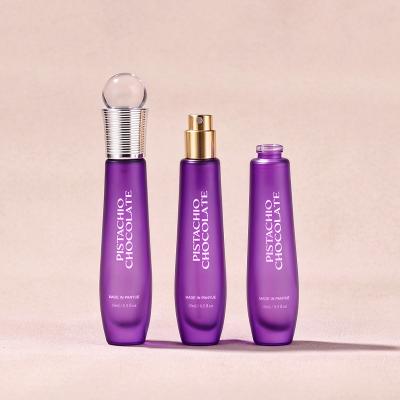 Botella tipo roll-on de vidrio morado de 15ml